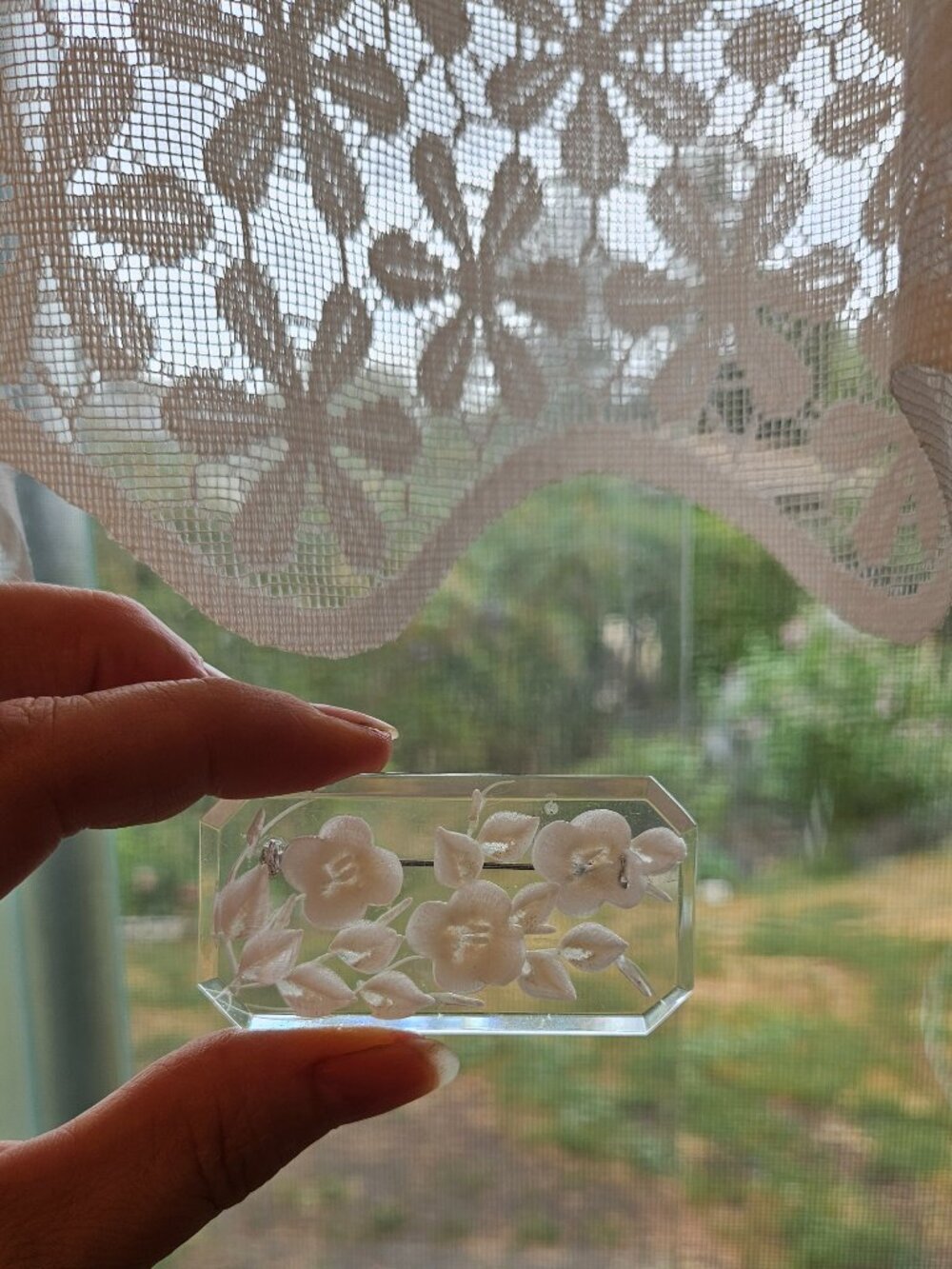 Vintage mid-century reverse-carved floral brooch